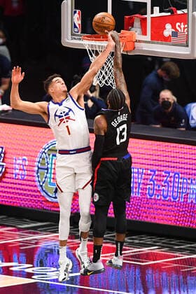 LOS ANGELES, CA - APRIL 01: Denver Nuggets Forward Michael Porter Jr. (1) hits Los Angeles Clippers Guard Paul George (13) hand after a missed dunk during a NBA, Basketball Herren, USA game between the Denver Nuggets and the Los Angeles Clippers on April 1, 2021 at STAPLES Center in Los Angeles, CA. The game was played without fans due to the COVID-19 pandemic. (Photo by Brian Rothmuller Icon Sportswire) NBA: APR 01 Nuggets at Clippers Icon210401034