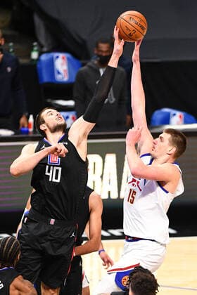 LOS ANGELES, CA - APRIL 01: Los Angeles Clippers Center Ivica Zubac (40) blocks Denver Nuggets Forward Nikola Jokic (15) shot during a NBA, Basketball Herren, USA game between the Denver Nuggets and the Los Angeles Clippers on April 1, 2021 at STAPLES Center in Los Angeles, CA. The game was played without fans due to the COVID-19 pandemic. (Photo by Brian Rothmuller Icon Sportswire) NBA: APR 01 Nuggets at Clippers Icon210401035