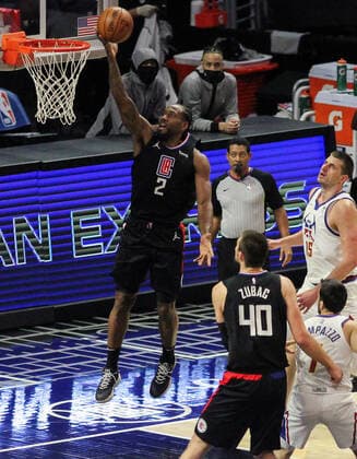 April 1, 2021: The Los Angeles Clippers vs. the Denver Nuggets at Staples Center in Los Angeles, CA on Thursday, April 1, 2021...Kawhi Leonard of the LA Clippers lays up the ball as Nikola Jokic of the Denver Nuggets watches on. - ZUMAa60_ 0116288870st Copyright: xPhillipxKimx