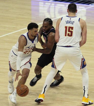 April 1, 2021: The Los Angeles Clippers vs. the Denver Nuggets at Staples Center in Los Angeles, CA on Thursday, April 1, 2021...Jamal Murray of the Denver Nuggets dribbles around Kawhi Leonard of the LA Clippers as Nikola Jokic sets a screen. - ZUMAa60_ 0116289132st Copyright: xPhillipxKimx