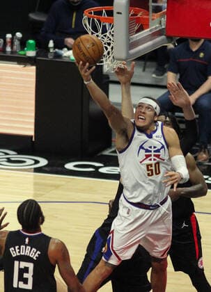 April 1, 2021: The Los Angeles Clippers vs. the Denver Nuggets at Staples Center in Los Angeles, CA on Thursday, April 1, 2021...Aaron Gordon of the Denver Nuggets goes for a layup as Paul George of the LA Clippers watches. - ZUMAa60_ 0116289133st Copyright: xPhillipxKimx