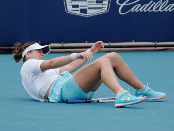Bianca Vanessa Andreescu from Canada falls after returning the ball to Ashleigh Barty from Australia in the women s finals at the Miami Open at Hard Rock Stadium in Miami Gardens, Florida on Saturday, April 3, 2021. Barty won 6-3, 4-0, Ret.  MIA20210403104 GARYxIxROTHSTEIN