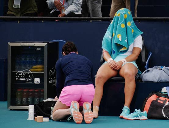 Bianca Vanessa Andreescu from Canada receives medical attention in the match against Ashleigh Barty from Australia in the women s finals at the Miami Open at Hard Rock Stadium in Miami Gardens, Florida on Saturday, April 3, 2021. Barty won 6-3, 4-0, Ret.  MIA20210403109 GARYxIxROTHSTEIN