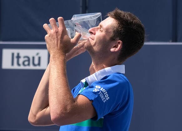 Hubert Hurkacz from Poland celebrates holding the championship trophy after defeating Jannik Sinner from Italy in the men s finals at the Miami Open in Hard Rock Stadium in Miami Gardens, Florida on Sunday, April 4, 2021. Hurkacz defeated 7-6, (7-4) 6-4.  MIA20210404118 GARYxIxROTHSTEIN