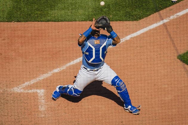 Kansas City Royals catcher Salvador Perez 13 catches a fly ball in the eighth inning against the Texas Rangers at Kaufman Stadium in Kansas City, Missouri on Sunday, April 4, 2021.  KCP20210404205 KYLExRIVAS