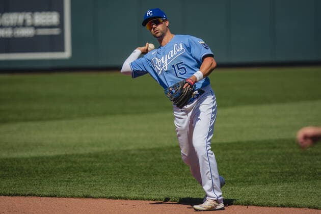 Kansas City Royals right fielder Whit Merrifield 15 throws out a Texas Rangers at first in the sixth inning at Kaufman Stadium in Kansas City, Missouri on Sunday, April 4, 2021.  KCP20210404208 KYLExRIVAS