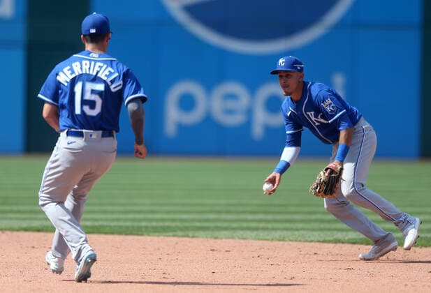 Kansas City Royals Nicky Lopez (8) flips the ball to Whit Merrifield (15) at second base to forces out Cleveland Indians Andrés Giménez (0) in the sixth inning at Progressive Field in Cleveland, Ohio on Wednesday, April 7, 2021.  CLE20210407119 AARONxJOSEFCZYK