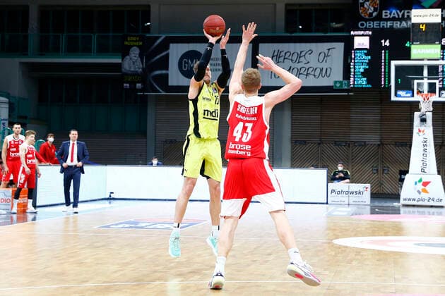 27 Matchday of the easyCredit BBL Basketball Bundesliga on 10 April 2021at the Oberfrankenhalle in Bayreuth Bavaria Germany Season 2020 2021 Medi Bayreuth vs Brose Bamberg Matthew Tiby Medi Bayreuth 15 left Christian Sengfelder Brose Bamberg 43 right