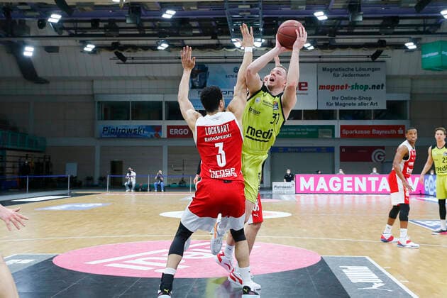 27 Matchday of the easyCredit BBL Basketball Bundesliga on 10 April 2021at the Oberfrankenhalle in Bayreuth Bavaria Germany Season 2020 2021 Medi Bayreuth vs Brose Bamberg Osvaldas Olisevicius Medi Bayreuth 31 right Dominic Lockhart Brose Bamberg 3 left