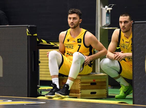 Basketball 2 Bundesliga 2020 2021 30 Matchday in Rottenburg at Volksbank Arena 10 04 2021 Tigers Tuebingen Bayer Giants Leverkusen Besnik Bekteshi li waits to be substituted in what could be his last game for the Tigers Tuebingen with Daniel Keppeler both Tigers Tuebingen