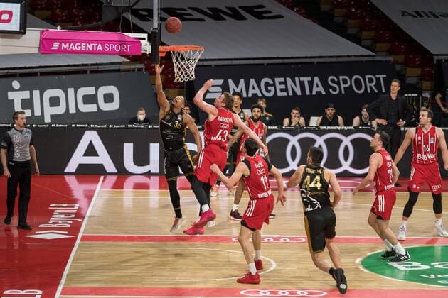 Basketball, BBL, 20210411, FC Bayern München Basketball Löwen Braunschweig In the picture Karim JALLOW Basketball Löwen Braunschweig, 35 and Leon RADOSEVIC FC Bayern München, 43 Munich Audi Dome Bayern Germany Copyright: Passion2Press MarkusxFischerx