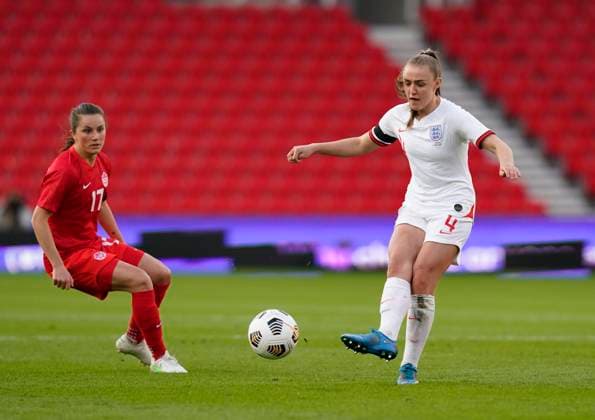 Stoke, England, 13th April 2021. Georgina Stanway of England and Jessie Fleming of Canada during the International Football Friendly match at The Bet365 Stadium, Stoke. Picture credit should read: Andrew Yates Sportimage EDITORIAL USE ONLY. No use with unauthorised audio, video, data, fixture lists, club league logos or live services. Online in-match use limited to 120 images, no video emulation. No use in betting, games or single club league player publications. SPI-0999-0001