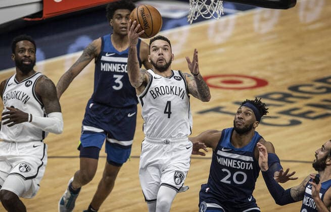 April 13, 2021, Minneapolis, MN, United States: Brooklyn Nets guard Chris Chiozza (4) scores over Minnesota Timberwolves forward Josh Okogie (20) at Target Center on Tuesday, April 13, 2021 in Minneapolis, Minnesota. Minneapolis United States - ZUMAm67_ 0116799640st Copyright: xJerryxHoltx