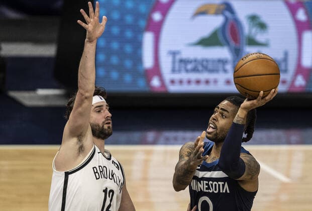April 13, 2021, Minneapolis, MN, United States: Minnesota Timberwolves guard D Angelo Russell (0) misses an off-balanced shot over Brooklyn Nets forward Joe Harris (12) at Target Center on Tuesday, April 13, 2021 in Minneapolis, Minnesota. Minneapolis United States - ZUMAm67_ 0116799641st Copyright: xJerryxHoltx