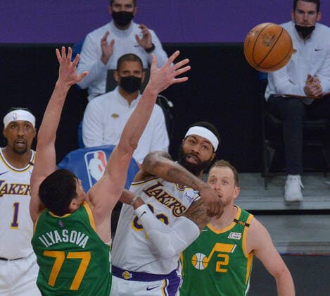 Los Angeles Lakers forward Markieff Morris makes the pass past Utah Jazz forward Ersan Ilyasova during the second half at Staples Center in Los Angeles on Saturday, April 17, 2021. The Lakers won with a 127-115 overtime defeat of the first-place Jazz.  LAP2021041722 JIMxRUYMEN