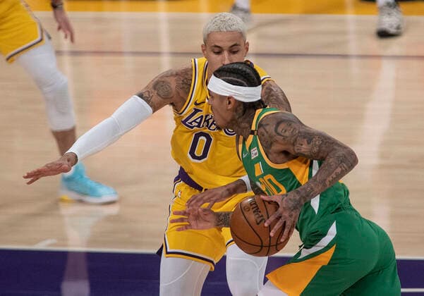 April 19, 2021, Los Angeles, California, USA: Kyle Kuzma 0 of the Los Angeles Lakers defends against Jordan Clarkson 00 of the Utah Jazz during their regular season NBA, Basketball Herren, USA game on Monday April 19, 2021 at the Staples Center in Los Angeles, California. Lakers lose to Jazz, 97-111. PI Los Angeles USA - ZUMAp124 20210419_zaa_p124_015 Copyright: xJAVIERxROJASx