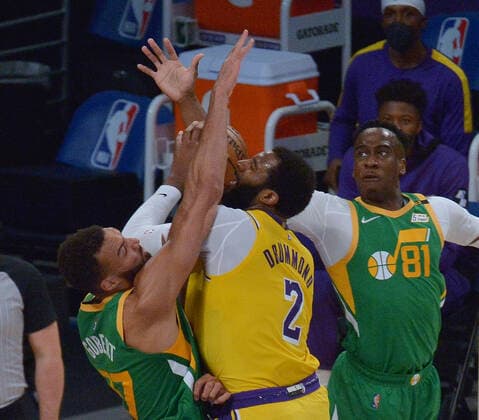 Utah Jazz center Rudy Gobert (27) fouls Los Angeles Lakers center Andre Drummond (2) during the second half of their NBA, Basketball Herren, USA game at Staples Center in Los Angeles on Monday, April 19, 2021. The Jazz defeated the Lakers 111-97.  LAP2021041903 JIMxRUYMEN