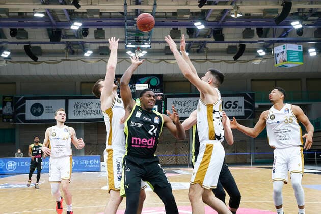 30 Matchday of the easyCredit BBL Basketball Bundesliga on 24 April 2021 at the Oberfrankenhalle in Bayreuth Bavaria Germany Season 2020 2021 Medi Bayreuth vs Basketball Löwen Braunschweig Frank Bartley Medi Bayreuth 24 center Benedikt Turudic Basketball Löwen Braunschweig 44 right