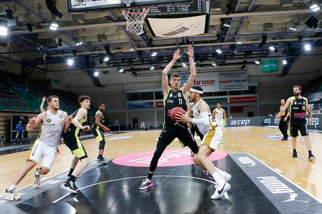 30 Matchday of the easyCredit BBL Basketball Bundesliga on 24 April 2021 at the Oberfrankenhalle in Bayreuth Bavaria Germany Season 2020 2021 Medi Bayreuth vs Basketball Löwen Braunschweig Andreas Seiferth Medi Bayreuth 11 left Gavin Schilling Basketball Löwen Braunschweig 34 right