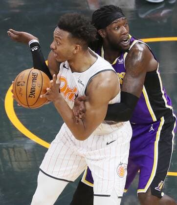 April 26, 2021, Orlando, Florida, USA: LA forward Montrezl Harrell, right, reacts to being called for a foul as he guards Orlando center Wendell Carter Jr. during the Los Angeles Lakers at Orlando Magic NBA, Basketball Herren, USA game at the Amway Center on Monday, April 26, 2021. Los Angeles won the game 114-103. Orlando USA - ZUMAm67_ 0116972393st Copyright: xStephenxM.xDowellx