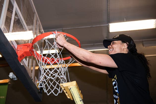 210427 Luleas Chioma Nnamaka cuts the net from the basket after and cheers for the Swedish Championship gold after final 5 in the ladies SBL between Alvik and Lulea on April 27, 2021 in Stockholm,  Copyright: JESPERxZERMAN BB210427JZ062