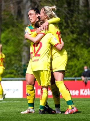 Cologne, Germany, April 28th 202 Sharon Beck (10 FcK?ln) celebrating the teams second goal with Peggy Kuznik (21 FcK?ln) and Alicia Gudorf (12 FcK?ln) during the 2. Frauen Bundesliga game between 1. Fc Koeln and Fc Bayern Muenchen II at the Franz-Kremer Stadion in Cologne, Germany. 2. Frauen Bundesliga - 1. Fc Koeln v Fc Bayern Muenchen II 