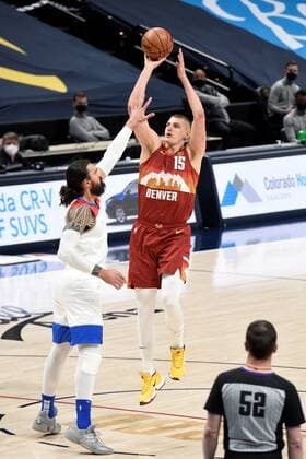 Denver Nuggets center Nikola Jokic 15 (R) goes up for a shot against New Orleans Pelicans center Steven Adams 12 (L) during a NBA, Basketball Herren, USA game, at the Ball Arena in Denver, CO, US, 28 April 2021. New Orleans Pelicans at Denver Nuggets !ACHTUNG: NUR REDAKTIONELLE NUTZUNG!  Copyright: xToddxPiersonx AME3546 20210429-637552659644544453