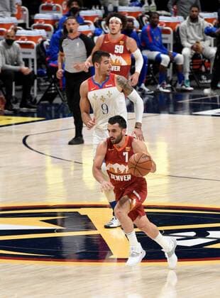 Denver Nuggets guard Facundo Campazzo 7 (R), brings the ball down court as he runs past New Orleans Pelicans center Willy Hernangomez 9 (C) during a NBA, Basketball Herren, USA game, at the Ball Arena in Denver, CO, US, 28 April 2021. New Orleans Pelicans at Denver Nuggets !ACHTUNG: NUR REDAKTIONELLE NUTZUNG!  Copyright: xToddxPiersonx AME3545 20210429-637552660268314118