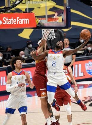New Orleans Pelicans forward Naji Marshall 8 (R) goes in for a basket against Denver Nuggets center JaVale McGee 34 (C), as New Orleans Pelicans forward James Johnson 16 (L), looks on during a NBA, Basketball Herren, USA game at the Ball Arena in Denver, CO, USA, 28 April 2021. New Orleans Pelicans at Denver Nuggets !ACHTUNG: NUR REDAKTIONELLE NUTZUNG!  Copyright: xToddxPiersonx AME3581 20210429-637552751258334869