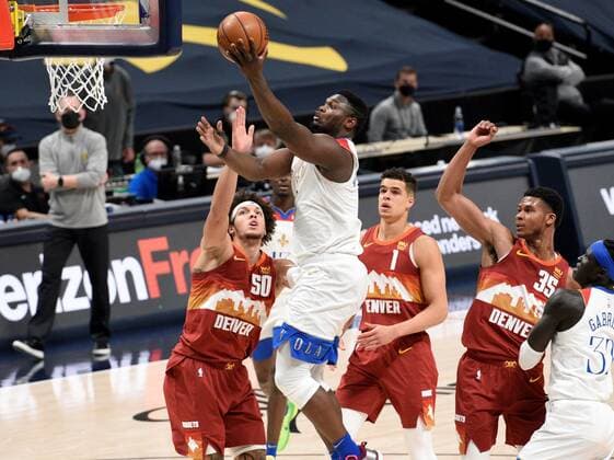 New Orleans Pelicans forward Zion Williamson 1 (CL) goes in for a basket against Denver Nuggets forward Aaron Gordon 50 (L), as Denver Nuggets forward Michael Porter Jr. 1 (CR) and Denver Nuggets guard PJ Dozier 35 and New Orleans Pelicans forward Wenyen Gabriel 32 (R) look on during a NBA, Basketball Herren, USA game at the Ball Arena in Denver, CO, USA, 28 April 2021. New Orleans Pelicans at Denver Nuggets !ACHTUNG: NUR REDAKTIONELLE NUTZUNG!  Copyright: xToddxPiersonx AME3582 20210429-637552752582409352