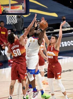 New Orleans Pelicans forward Zion Williamson 1 (C) goes in for a basket against Denver Nuggets forward Aaron Gordon 50 (L) and Denver Nuggets forward Michael Porter Jr. 1 (R), during a NBA, Basketball Herren, USA game at the Ball Arena in Denver, CO, USA, 28 April 2021. New Orleans Pelicans at Denver Nuggets !ACHTUNG: NUR REDAKTIONELLE NUTZUNG!  Copyright: xToddxPiersonx AME3583 20210429-637552752608659679
