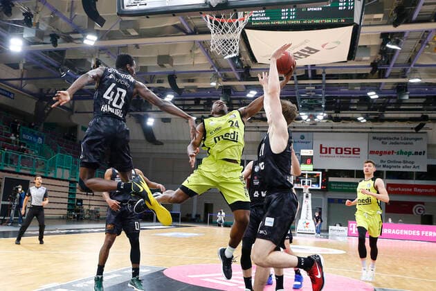 31 Matchday of the easyCredit BBL Basketball Bundesliga on 29 April 2021in the Oberfrankenhalle in Bayreuth Bavaria Germany season 2020 2021 Medi Bayreuth vs Basketball Hamburg Towers Frank Bartley Medi Bayreuth 24 center Zac Cuthbertson Hamburg Towers 40 left