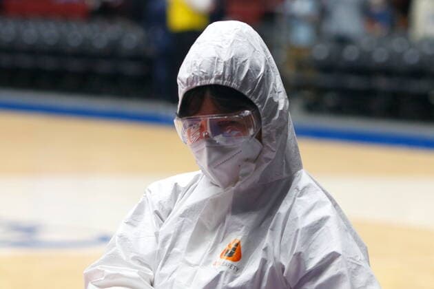 Saint Petersburg, Russia - 30 April 2021: Medical workers on Coronavirus are seen in action during the 2020-2021 Playoffs EuroLeague, match 4 between FC Barcelona, Barca and Zenit. MaksimxKonstantinov
