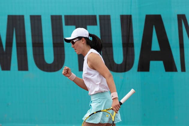 (210501) -- MADRID, May 1, 2021 -- Zheng Saisai of China celebrates during the women s single 1st round match against Magda Linette of Poland at the Madrid Open tennis tournament in Madrid, Spain, April 30, 2021. ) (SP)SPAIN-MADRID-TENNIS-MADRID OPEN MengxDingbo 