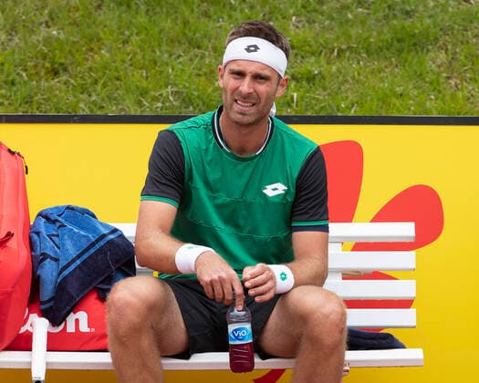 Norbert Gombos SVK sits on bench during break in play Copyright: xJuergenxHasenkopfx