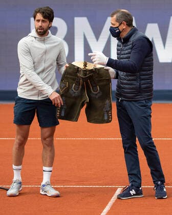 Organizer Michael Mronz presents the winner Nikoloz Basilashvili GEO with a Bavarian Lederhosen, Mens Singles, Award Ceremony, Presentation Tennis BMW Open 2021 ATP MTTC Iphitos Munich Germany 2 May 2021 Copyright: xJuergenxHasenkopfx