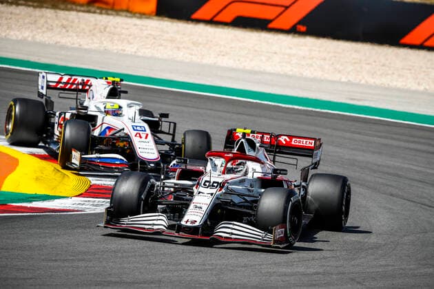 99 GIOVINAZZI Antonio (ita), Alfa Romeo Racing ORLEN C41, action and 47 SCHUMACHER Mick (ger), Haas F1 Team VF-21 Ferrari during the Formula 1 Heineken Grande PrŽmio de Portugal 2021 from April 30 to May 2, 2021 on the Algarve International Circuit, in Portimao, Portugal FORMULE 1 : Grand Prix du Portugal - Course - Portimao - 01 05 2021 DPPI Panoramic  _B2_7365