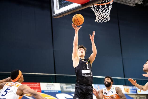 BARMER 2 Basketball Bundesliga ProA Playoff Matchday 6 Season 2020 2021 on 02 5 2021 Rostock Seawolves vs Science City Jena center Dennis Nawrocki Jena at the basket against left Chris Carter Rostock 5 and right Travor Lacey Rostock 7 Stadthalle Rostock