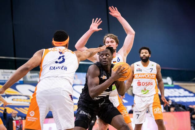 BARMER 2 Basketball Bundesliga ProA Playoff Matchday 6 Season 2020 2021 on 02 5 2021 Rostock Seawolves vs Science City Jena center Norense Odiase Jena on the ball against left Chris Carter Rostock and behind Till Gloger Rostock Stadthalle Rostock