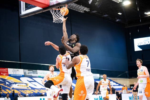 BARMER 2 Basketball Bundesliga ProA Playoff Matchday 6 Season 2020 2021 on 02 5 2021 Rostock Seawolves vs Science City Jena center Norense Odiase Jena at the basket against Behnam Yakhchali Rostock and Trevor Lacey Rostock Stadthalle Rostock