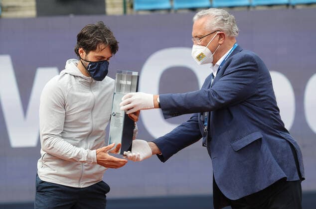 Tennis BMW Open 2021 at MTTC Iphitos in Munich Final Minister of the Interior Joachim Herrmann at the award ceremony hands over the trophy to Nikoloz Basilashvili Munich Bavaria Germany Facility of MTTC Iphitos