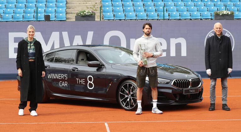 Tennis BMW Open 2021 at MTTC Iphitos in Munich Final The winner Nikoloz Basilashvili with trophy, on the left Lena Gercke, on the right BMW board member Pieter Nota Munich Bavaria Germany Facility of MTTC Iphitos