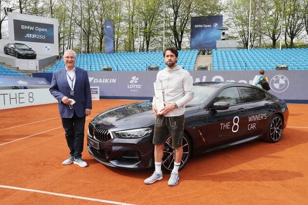 Tennis BMW Open 2021 at the MTTC Iphitos in Munich Final Minister of the Interior Joachim Herrmann and the winner of the BMW Open Nikoloz Basilashvili with trophy and the winning car Munich Bavaria Germany Facility of the MTTC Iphitos