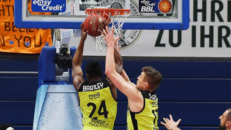 Basketball, 1 Bundesliga, season 2020 2021, 32 matchday, SYNTAINICS MBC Mitteldeutscher Basketball Club Weissenfels vs medi bayreuth 02 05 2021 Frank Bartley medi Bayreuth, back number 24 li and Andreas Seiferth medi Bayreuth, back number 11 at the basket during the match Weißenfels vs Bayreuth 02 05 2021 Weißenfels Sachsen Anhalt Germany Stadthalle Weißenfels