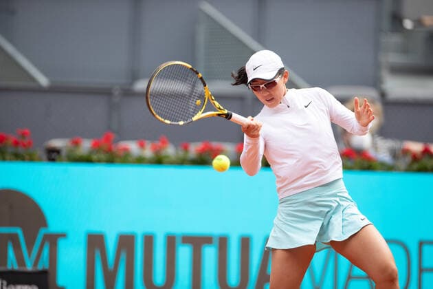 (210503) -- MADRID, May 3, 2021 -- Zheng Saisai of China returns the ball during the women s singles 2nd round match against Simona Halep of Romania at the Madrid Open tennis tournament in Madrid, Spain, May 2, 2021. ) (SP)SPAIN-MADRID-TENNIS-MADRID OPEN MengxDingbo 