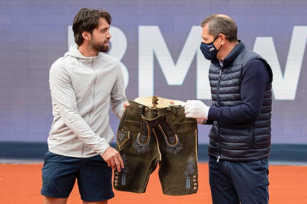Organizer Michael Mronz presents the winner Nikoloz Basilashvili GEO with a pair of Bavarian Lederhosen, Mens Singles, Award Ceremony, Presentation Copyright: xJuergenxHasenkopfx