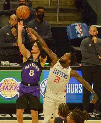 Los Angeles Clippers guard Patrick Beverley fouls Toronto Raptors guard Malachi Flynn during the second half at Staples Center in Los Angeles on Tuesday, May 4, 2021. The Clippers defeated the Raptors 105-100 to end a three-game losing streak.  LAP2021050408 JIMxRUYMEN