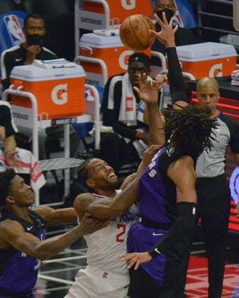 Toronto Raptors forward Freddie Gillespie (55) blocks the shot of Los Angeles Clippers forwards Kawhi Leonard (2) during the second half at Staples Center in Los Angeles on Tuesday, May 4, 2021. The Clippers defeated the Raptors 105-100 to end a three-game losing streak.  LAP2021050409 JIMxRUYMEN