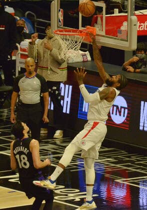 Los Angeles Clippers guard Paul George (13) scores on Toronto Raptors forward Yuta Watanabe (18) during the second half at Staples Center in Los Angeles on Tuesday, May 4, 2021. The Clippers defeated the Raptors 105-100 to end a three-game losing streak.  LAP2021050404 JIMxRUYMEN