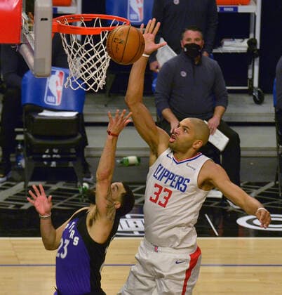 Toronto Raptors guard Fred Van Fleet (23) scores on Los Angeles Clippers forward Nicolas Batum (33) during the second half at Staples Center in Los Angeles on Tuesday, May 4, 2021. The Clippers defeated the Raptors 105-100 to end a three-game losing streak.  LAP2021050407 JIMxRUYMEN